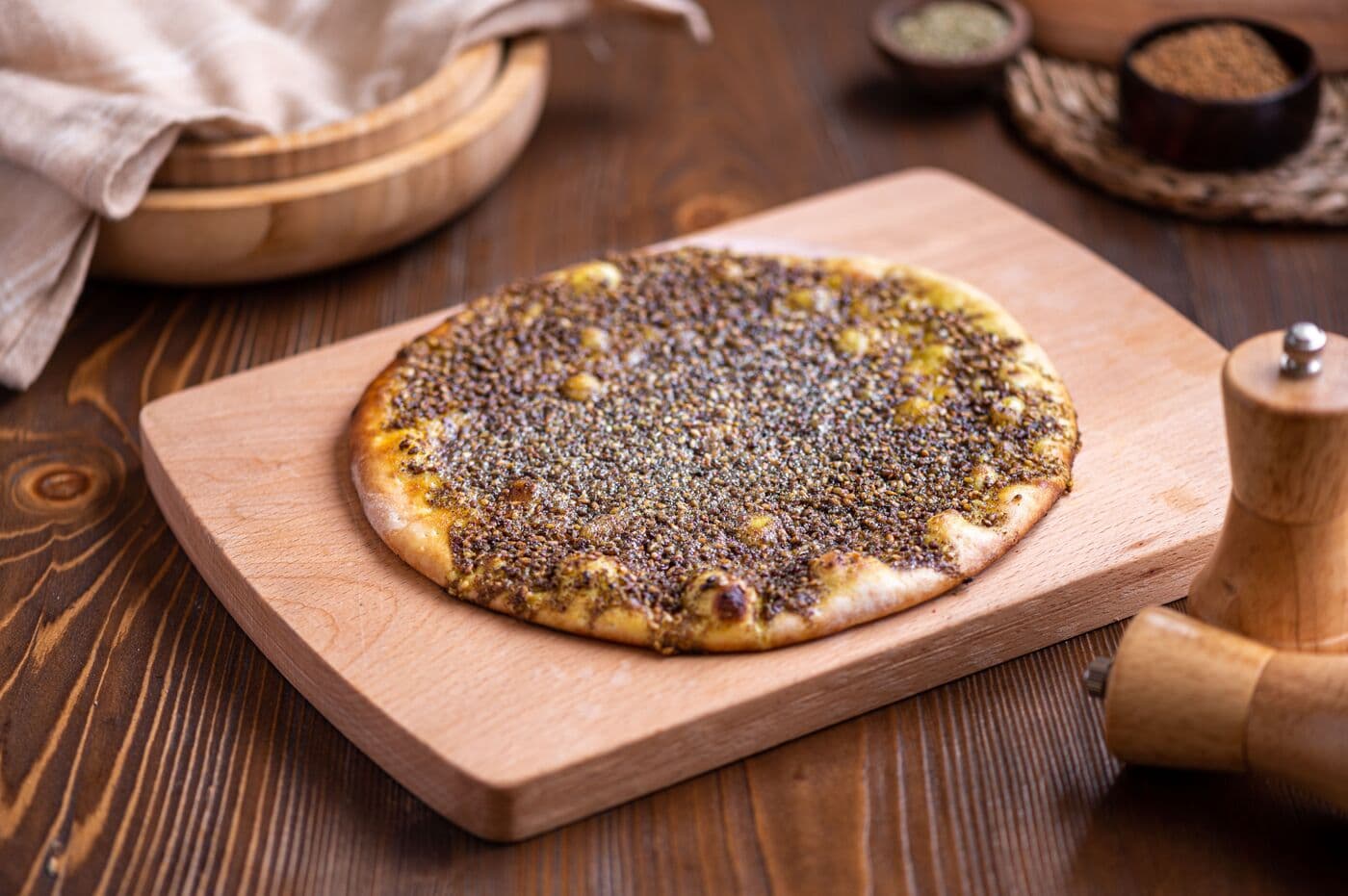 Contemporary za’atar manakish, topped with herbs and sesame